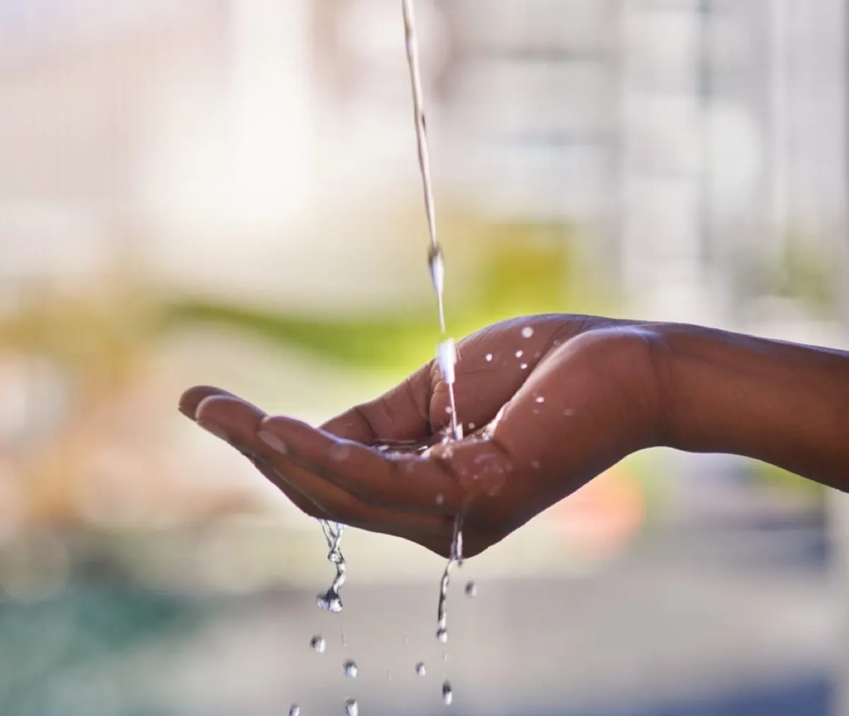 cropped shot of a man washing his hands with refreh