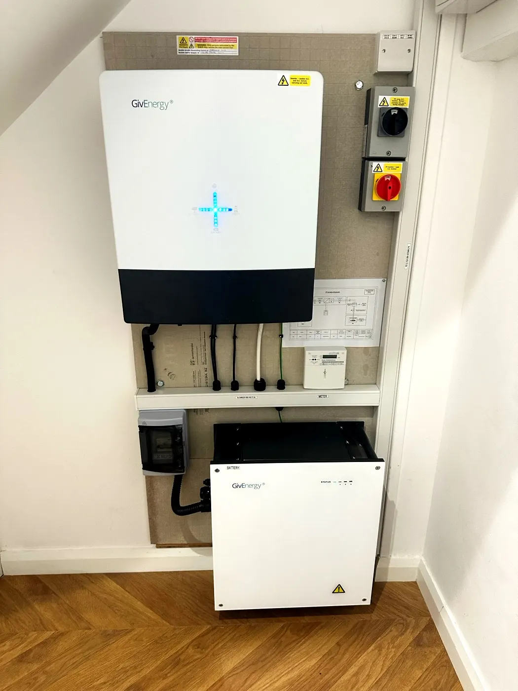 Inverter and battery fitted in an under-stairs cupboard — Glow install