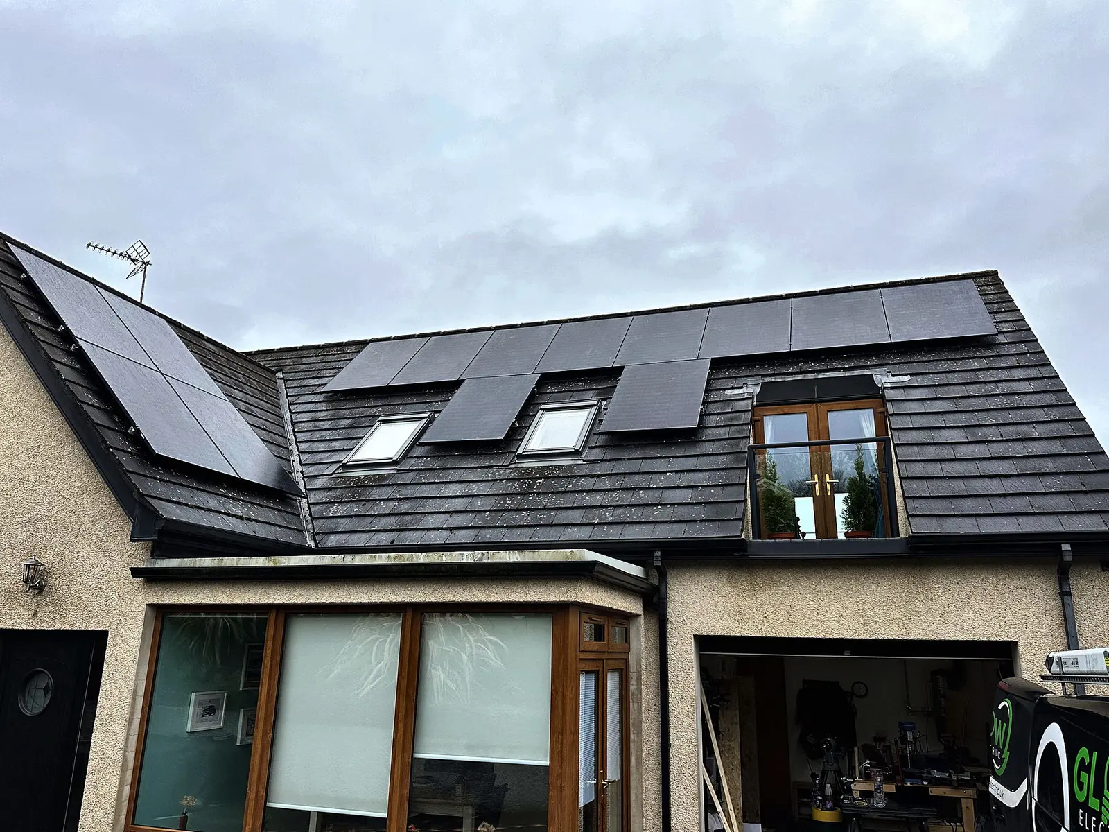 All-black panels fitted around the rooflights of a slate dormer bungalow — Glow install