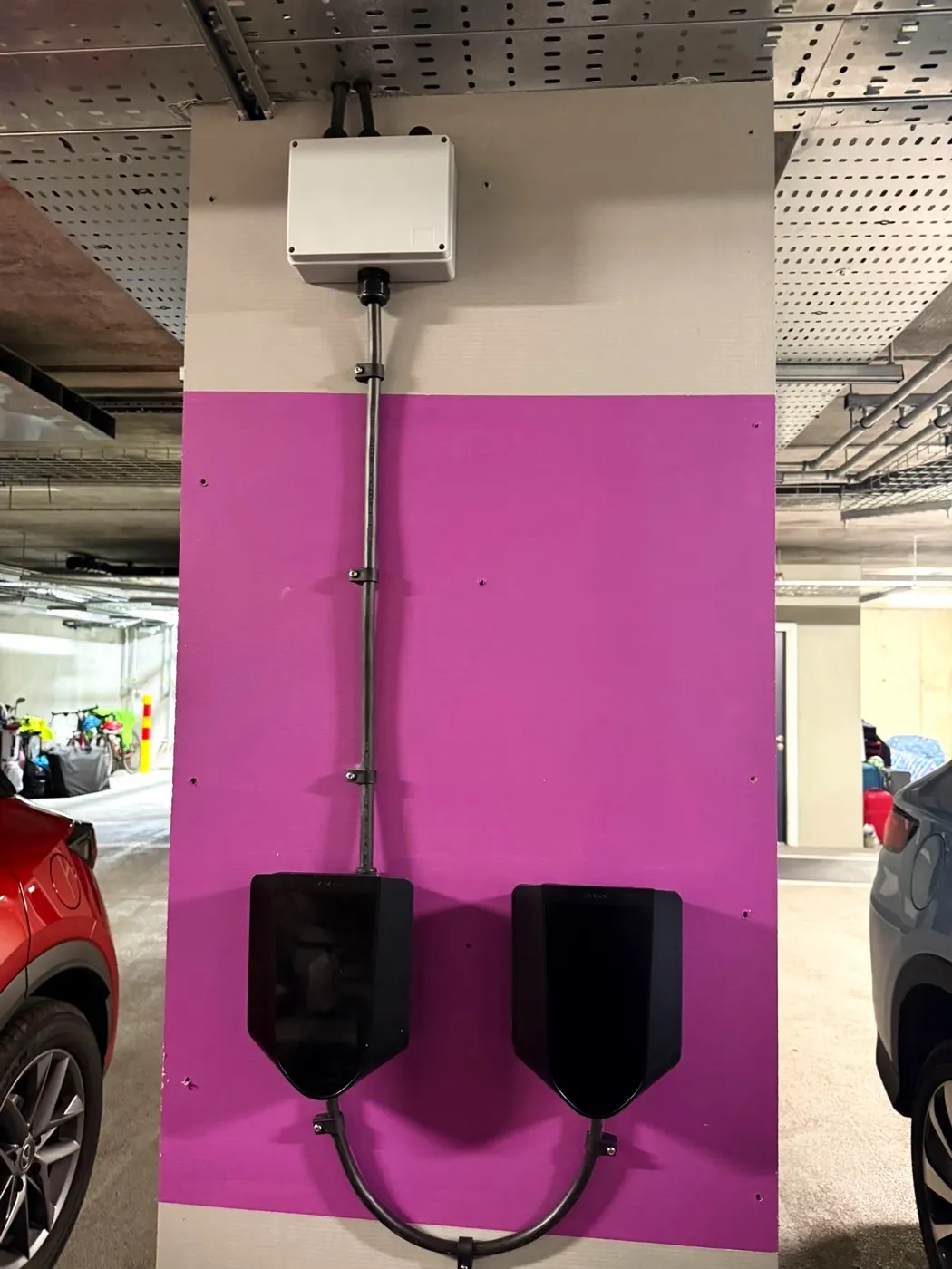 Twin EV chargers installed by Glow in an underground car park