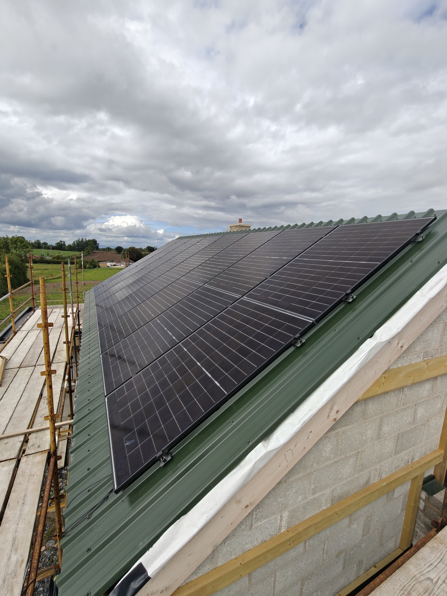 All-black solar array on a metal roof, installed by Glow